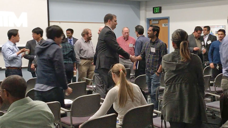 The group in 101 takes their first break and informal discussions break out