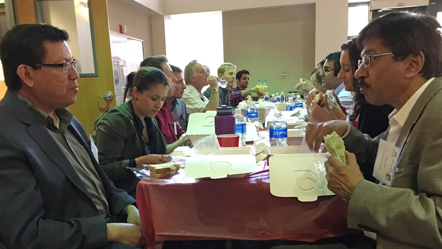 Dr. Gabriel Lopez enjoys an informal discussion at lunch